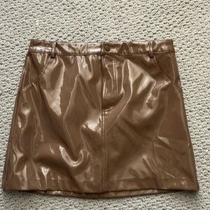 Fun Carmel colored patent leather mini skirt. NWT size large